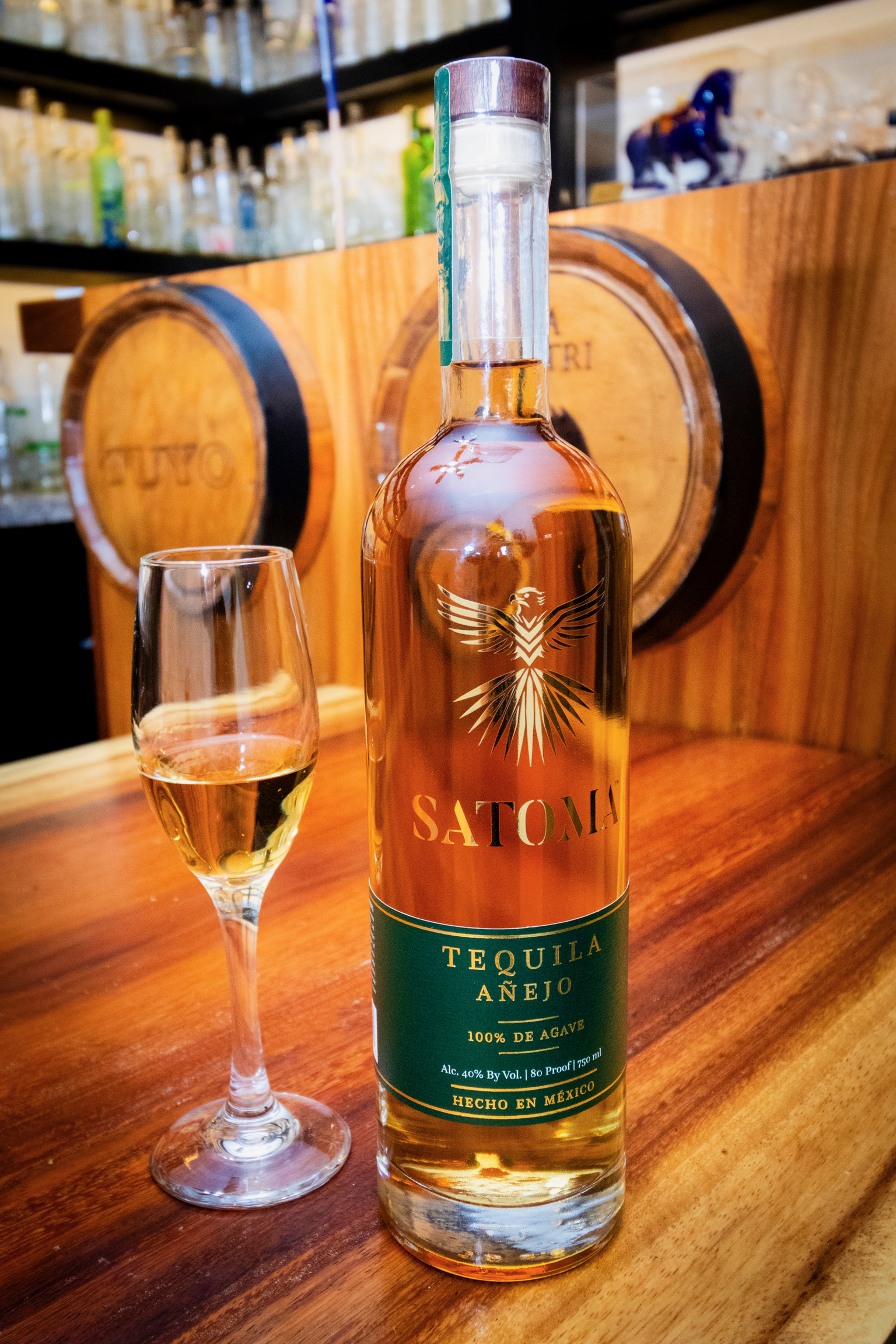 Satoma Añejo with glass on the bar